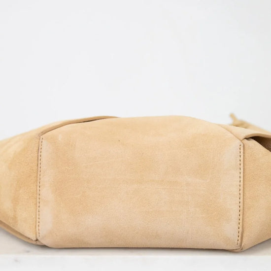 Beige handbag on a white background