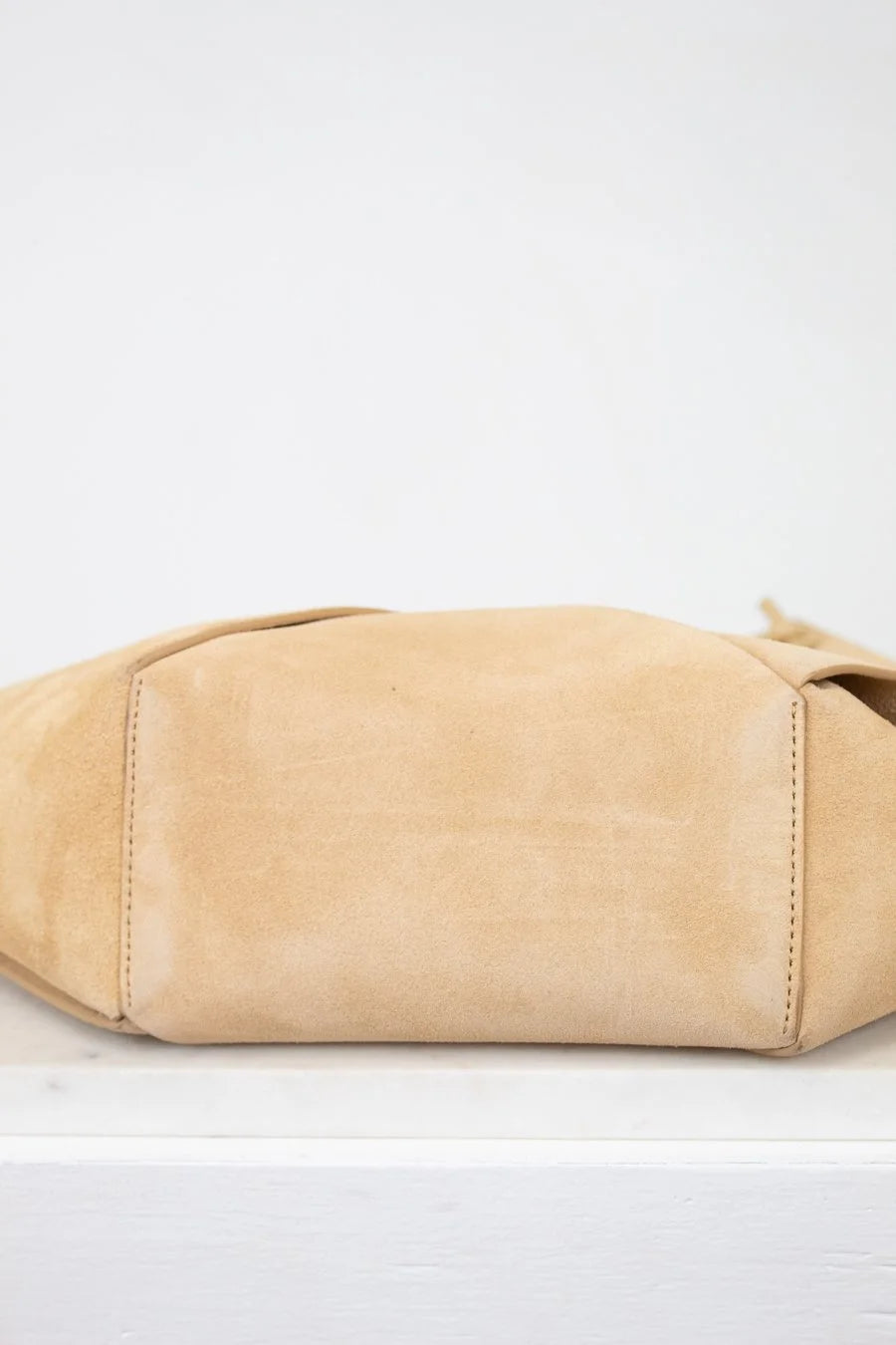Beige handbag on a white background