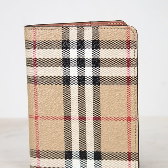 Plaid patterned wallet on a light background