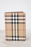 Plaid patterned wallet on a light background