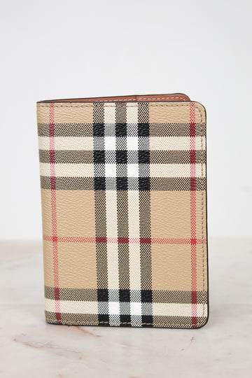 Plaid patterned wallet on a light background
