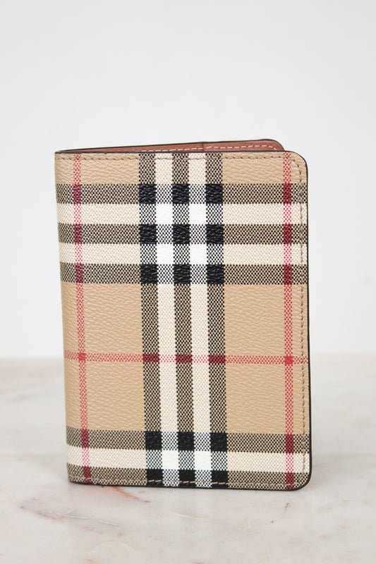 Plaid patterned wallet on a light background