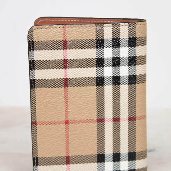 Plaid patterned wallet on a white background