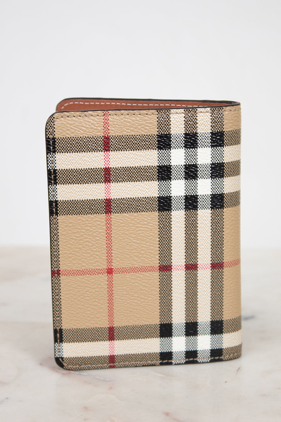 Plaid patterned wallet on a white background