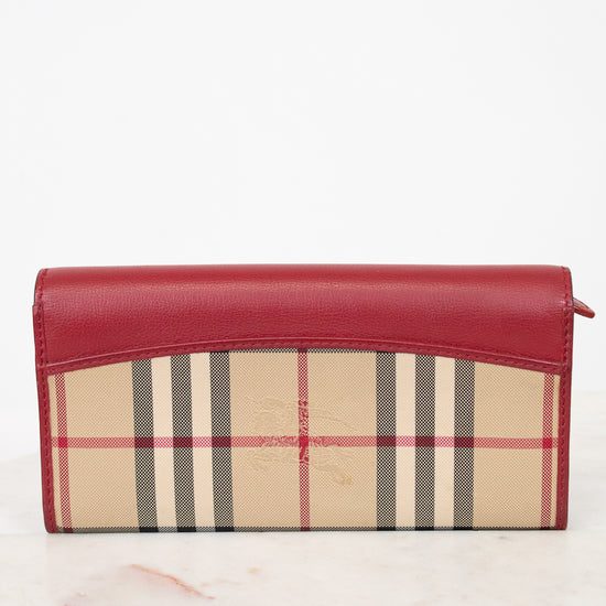 Red and beige checkered wallet on a white background