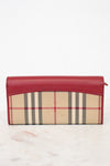 Red and beige checkered wallet on a white background
