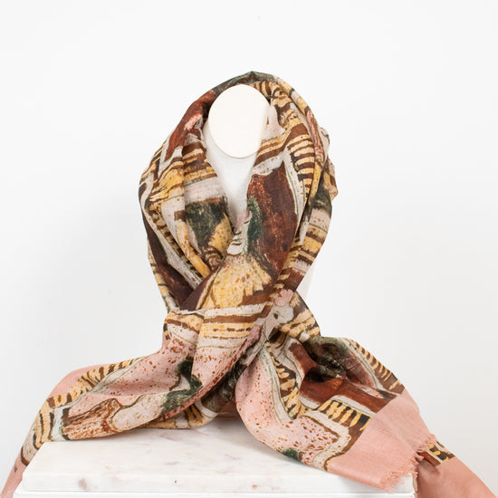 Photo of light material with neutral tone abstract patterns displayed on a bust 