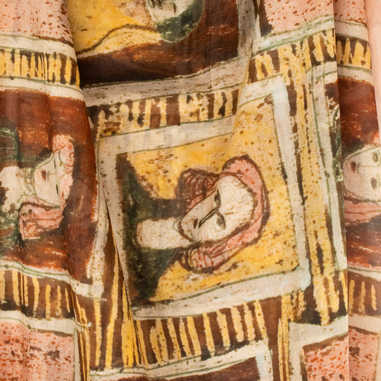 Close-up of neutral toned framed portraits printed on a light material scarf