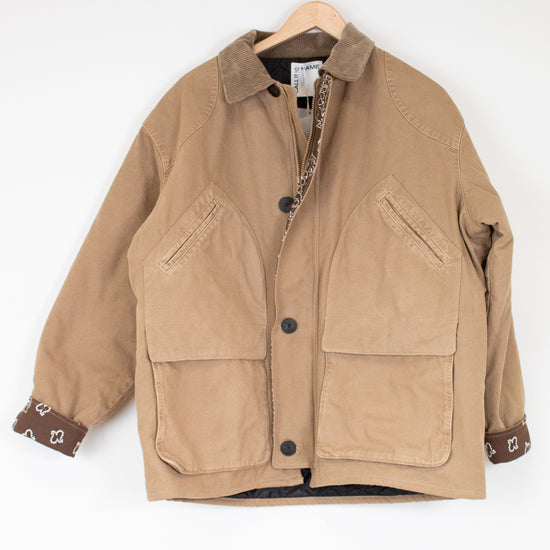 Brown jacket on a hanger against a white background