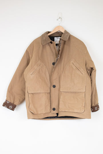 Brown jacket on a hanger against a white background
