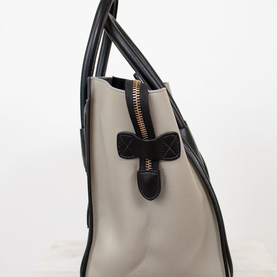 Color-block handbag with black accents on a white background