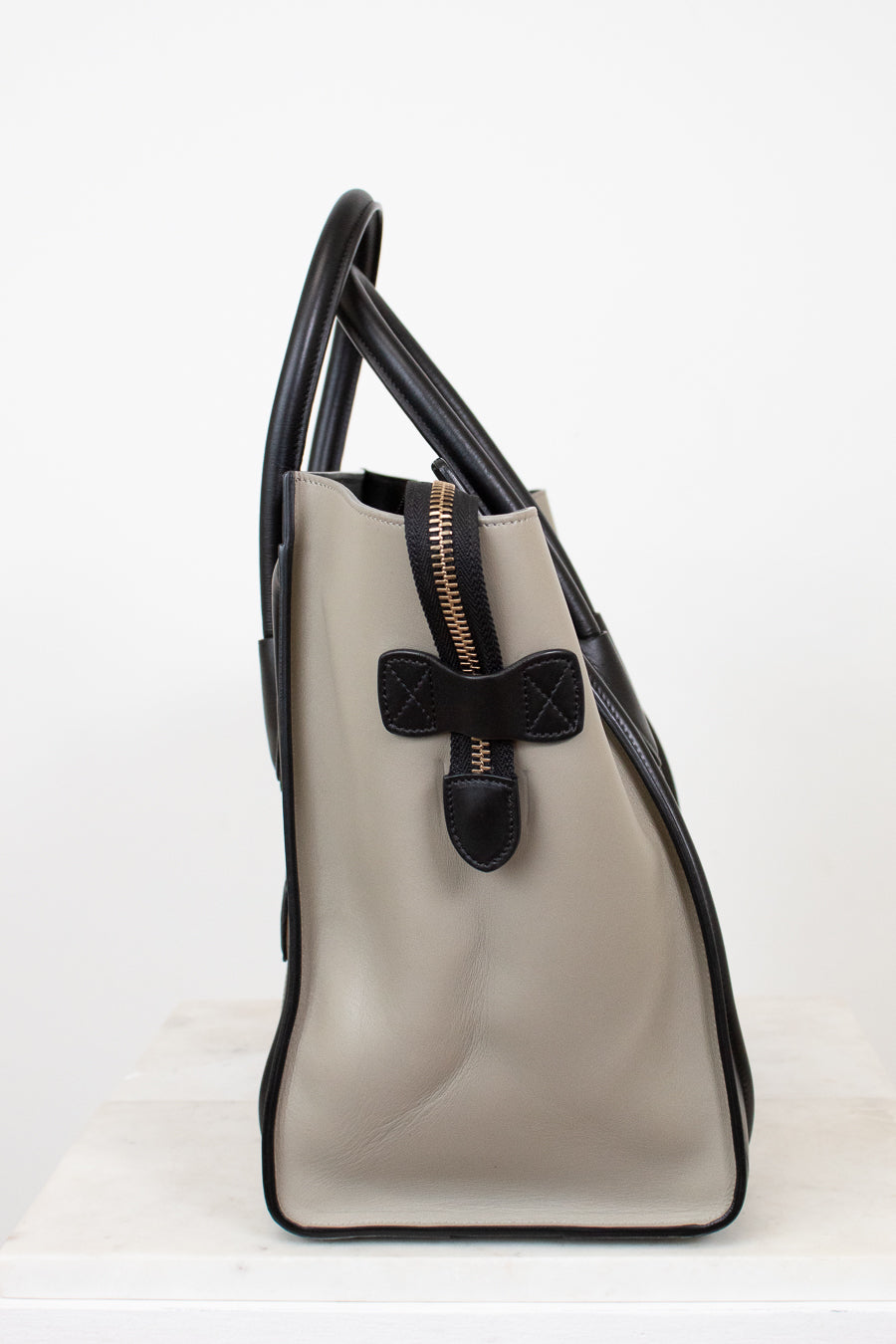 Color-block handbag with black accents on a white background