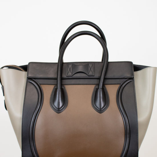 Multi-toned handbag with black and brown design on a white background