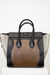 Multi-toned handbag with black and brown design on a white background