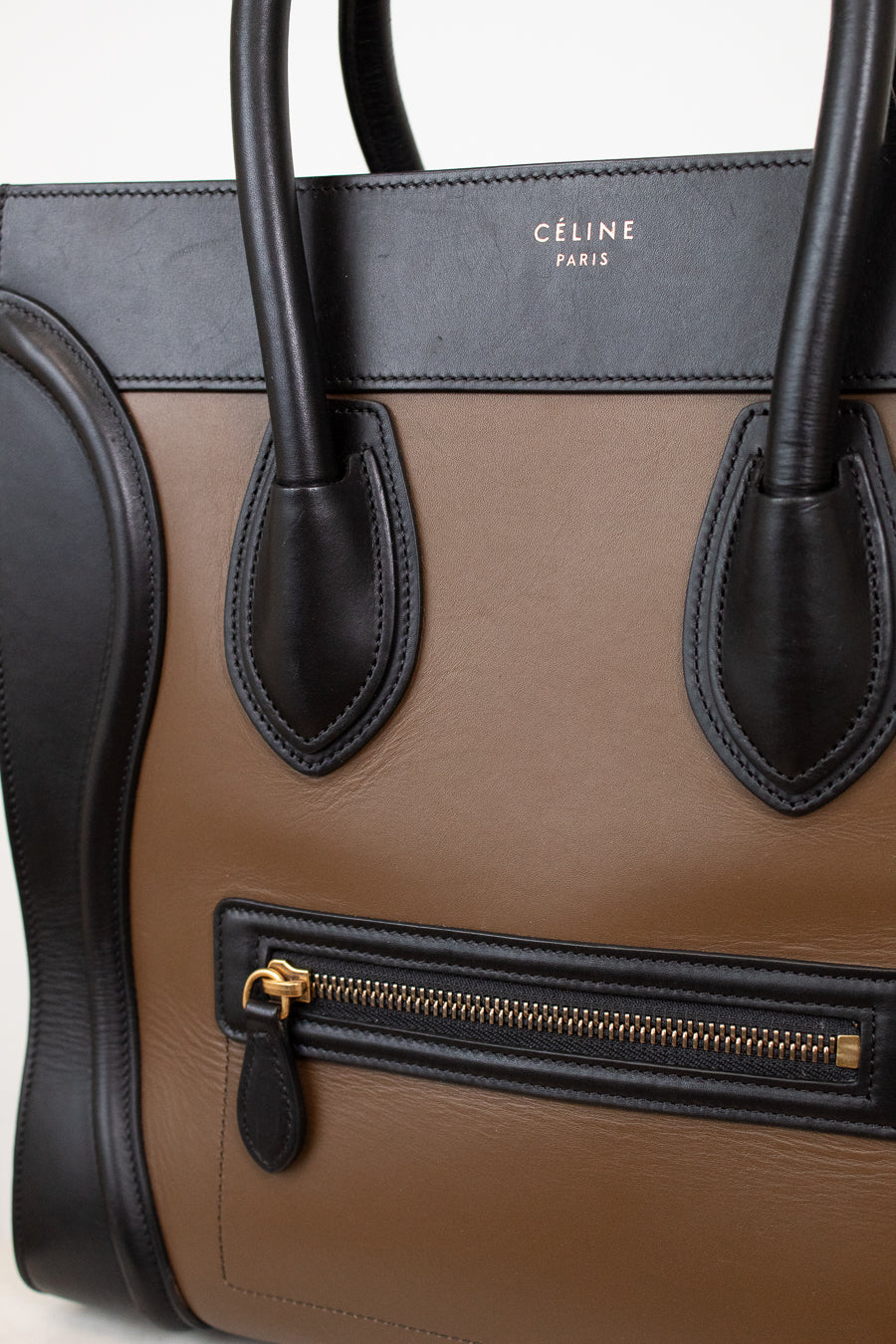 Celine handbag with brown, black, and gray color scheme on a white background