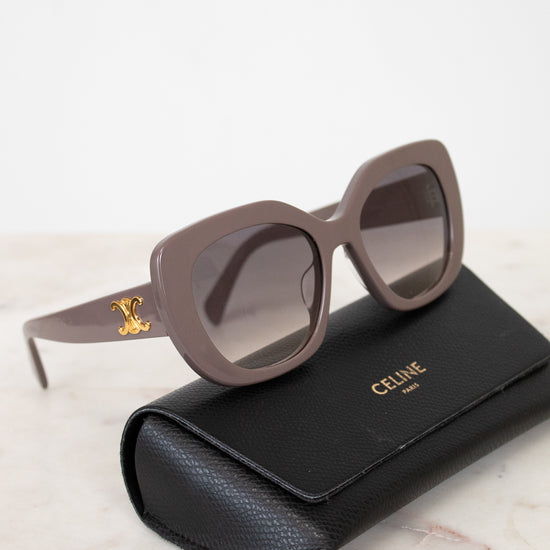 Celine sunglasses on a marble surface with a black case