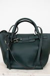 Green handbag with a strap on a white background