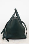 Green leather handbag on a white background