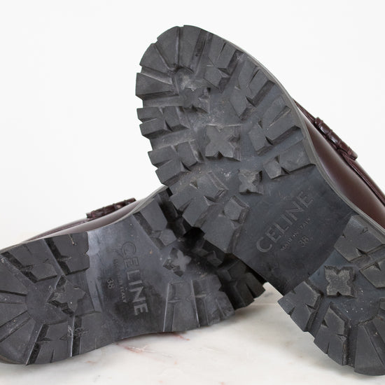Close-up of loafers with 'CELINE' branding on a light background