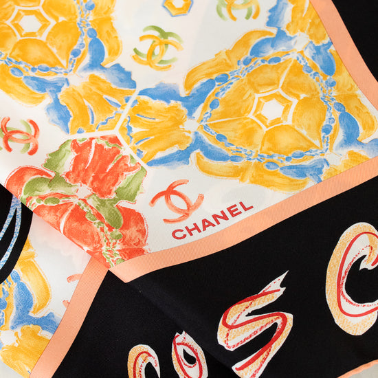 Chanel scarves with colorful designs and branding.