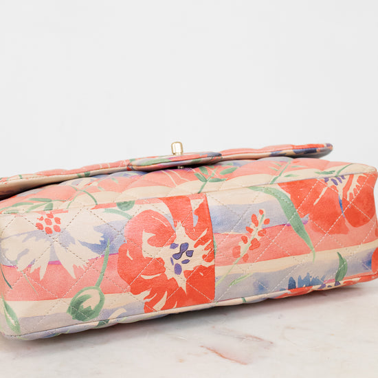Floral-patterned crossbody bag base on a light surface