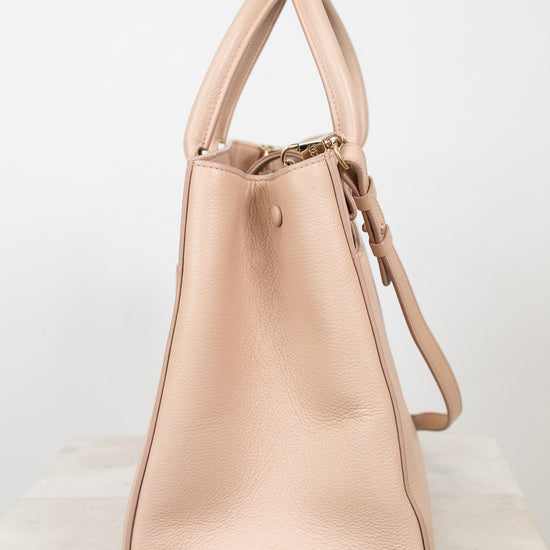 Beige handbag on a white background