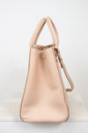 Beige handbag on a white background