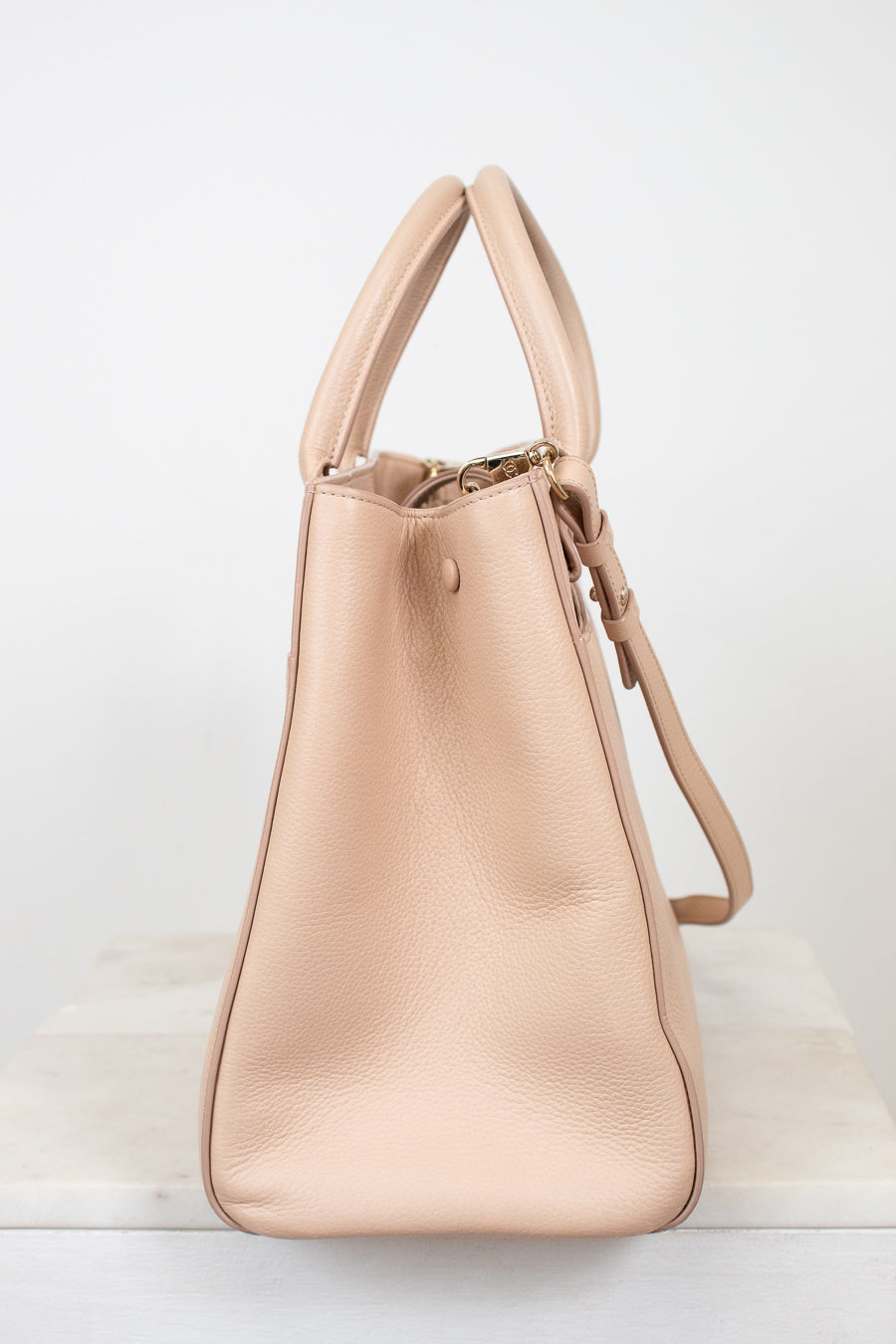 Beige handbag on a white background