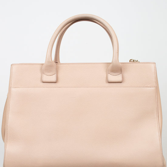 Beige handbag on a white background