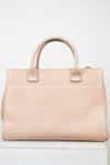 Beige handbag on a white background