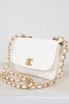 White handbag with gold chain and logo on a white background