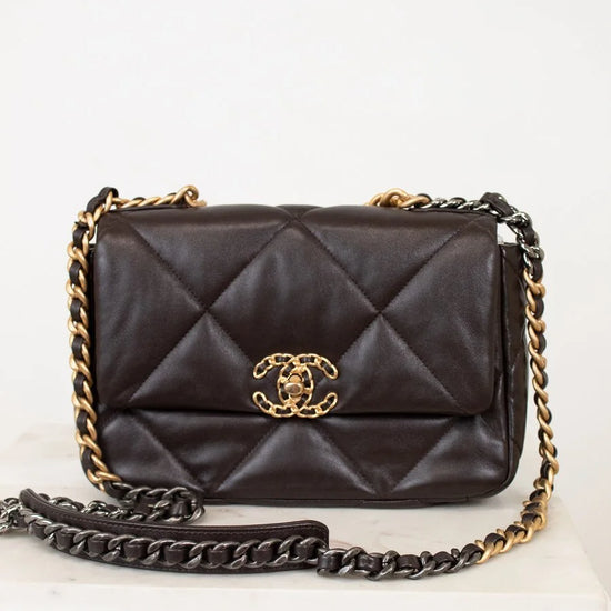 Dark Brown quilted handbag with gold chain strap on a white background