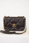 Dark Brown quilted handbag with gold chain strap on a white background