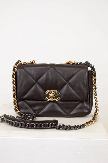 Dark Brown quilted handbag with gold chain strap on a white background