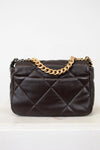 Dark Brown quilted handbag with a gold chain strap on a white background