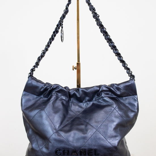 Chanel handbag with chain handle on a white background