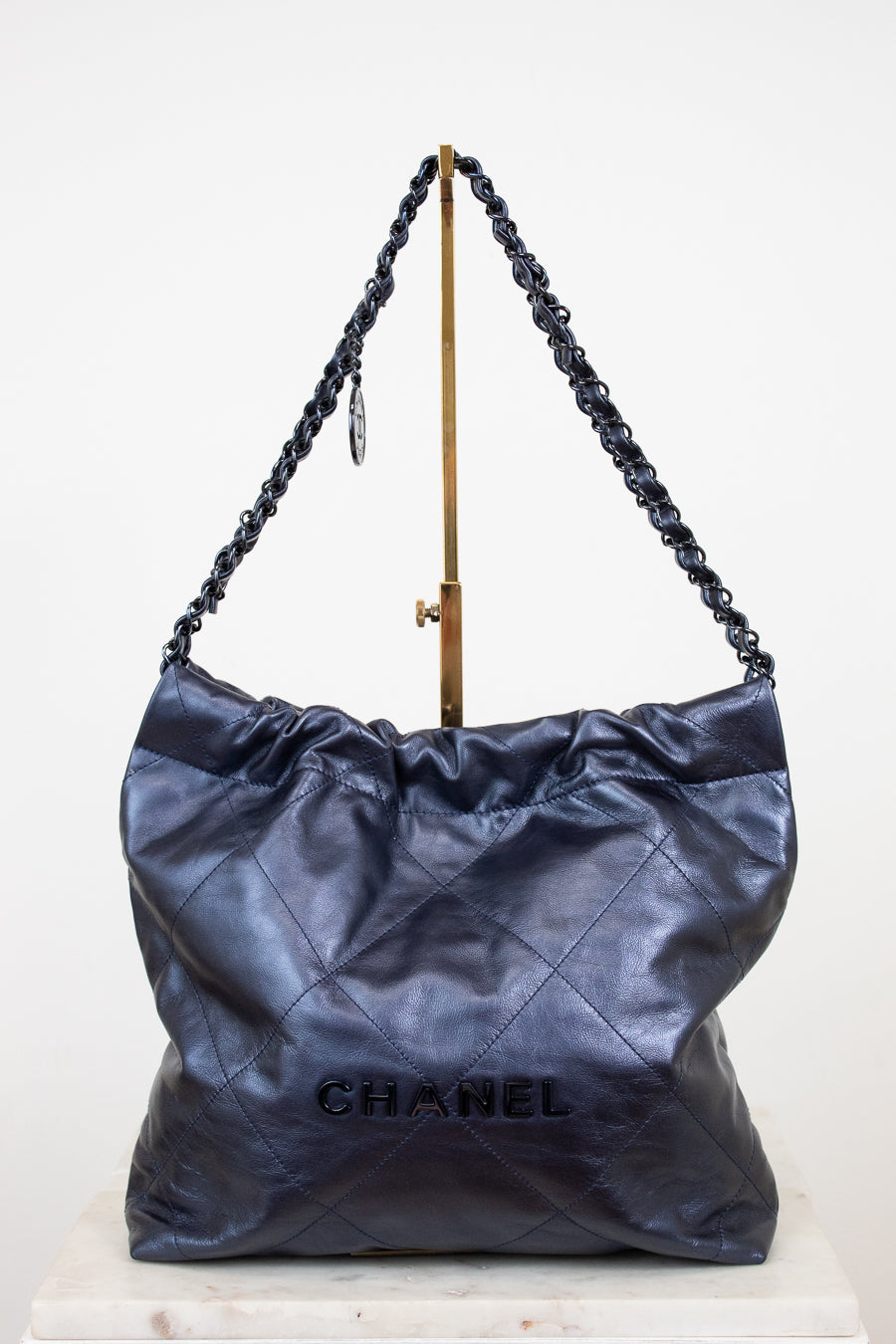 Chanel handbag with chain handle on a white background