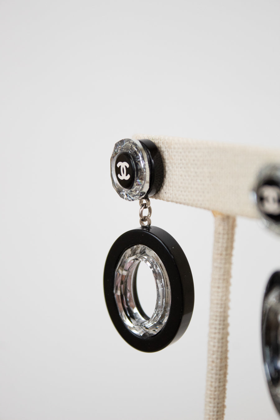 Black and clear earrings on a white background