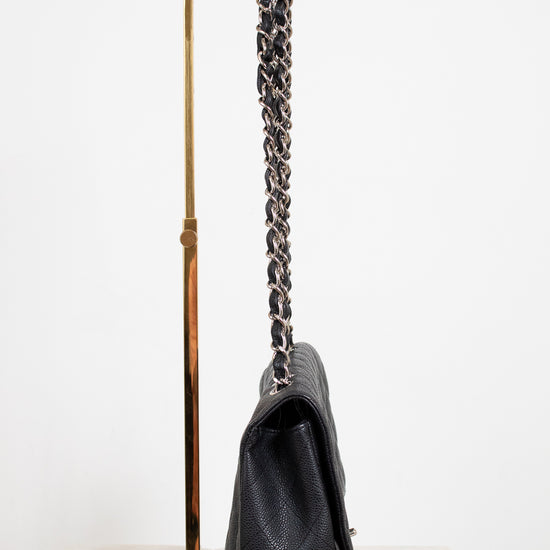 Black handbag with a chain strap on a white background