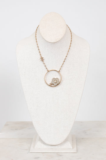 Necklace with a pendant on a mannequin bust against a white background