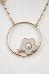 Necklace with a floral pendant and pearl on a white background