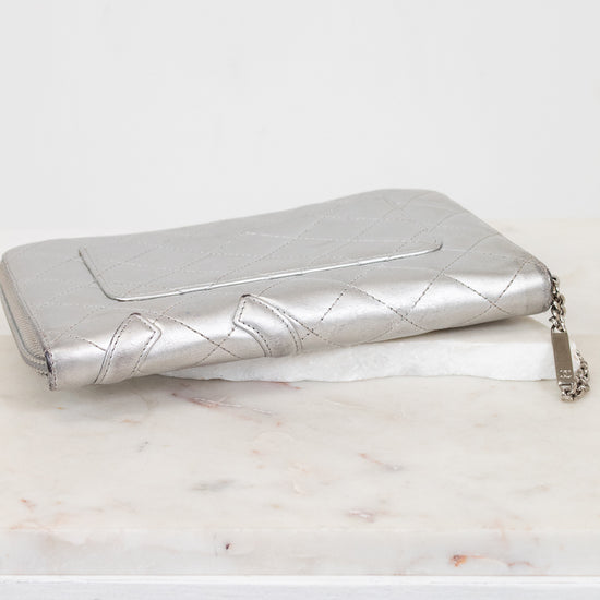 Quilted silver wallet on a white background