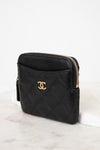 Black quilted wallet with gold logo on a white background