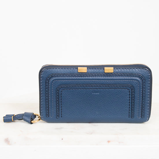 Blue wallet with gold accents on a white background