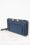 Blue wallet with gold zipper on a white background