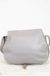 Back view of grey leather saddle crossbody bag on white background