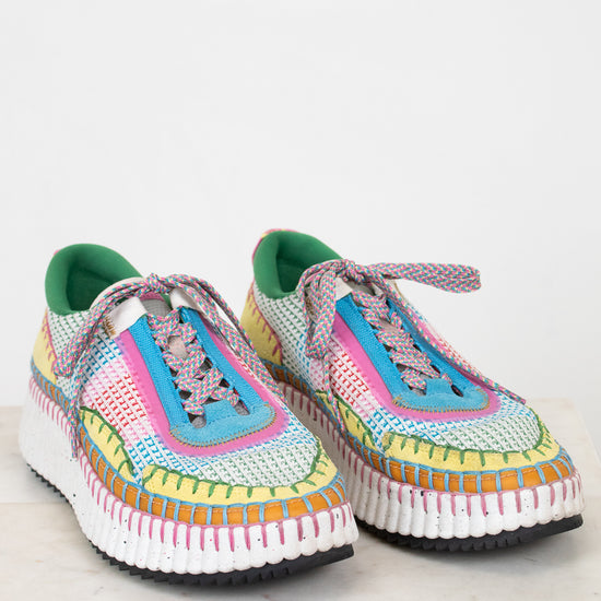 Colorful crochet sneakers on a white background