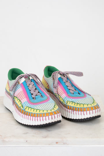 Colorful crochet sneakers on a white background