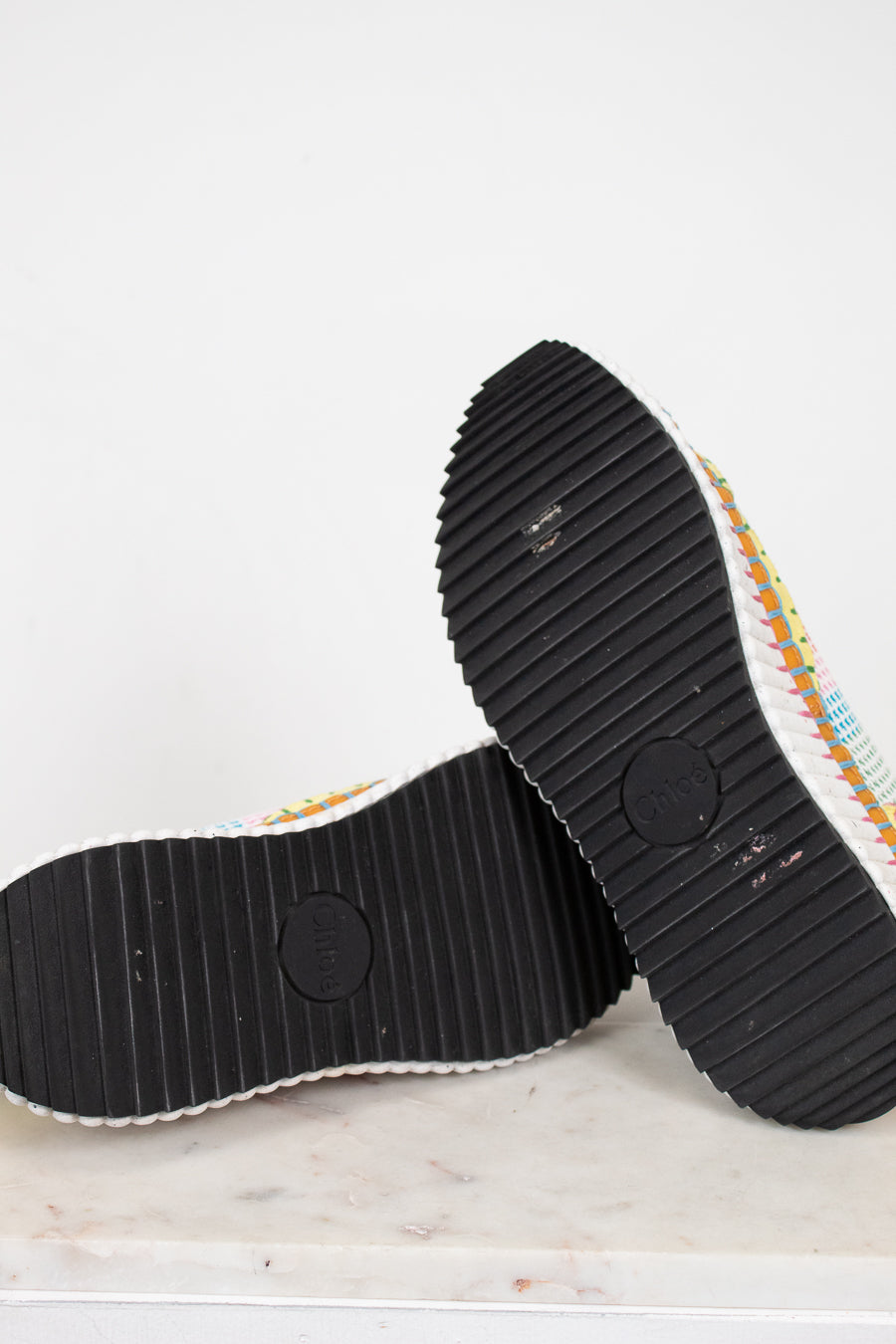 Close-up of black sole shoes on a white background