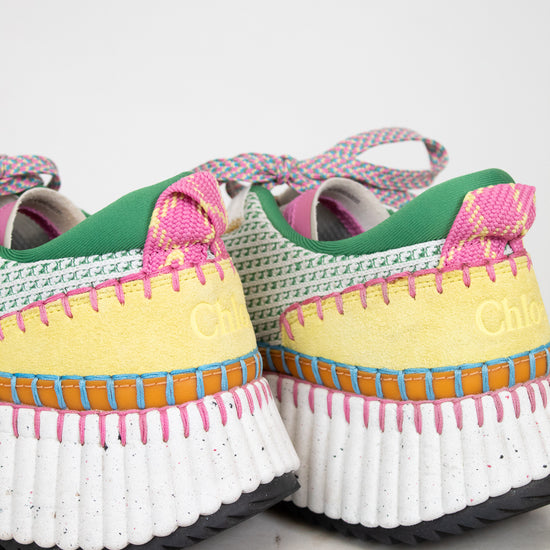 Colorful sneakers with white soles on a light background
